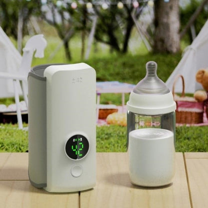 Portable air purifier and baby bottle on a wooden table outdoors